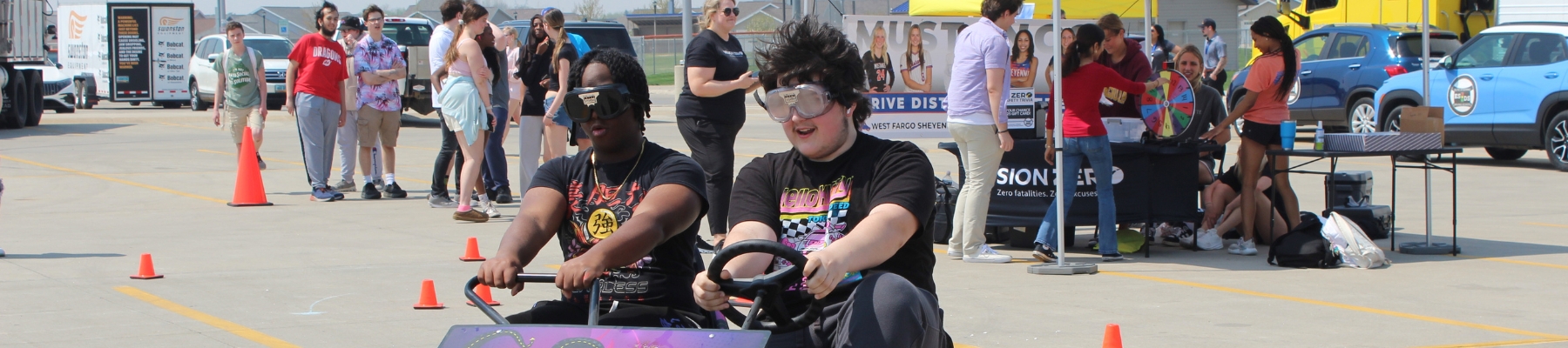 Young students driving a go-cart at a Vision Zero Event