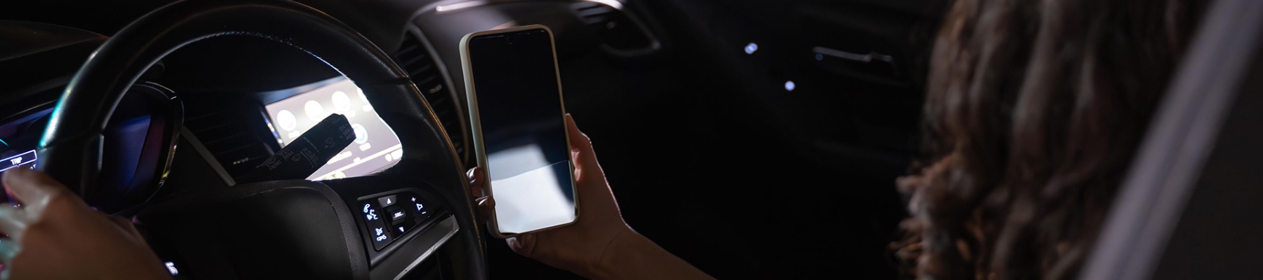 Image of driver using their phone