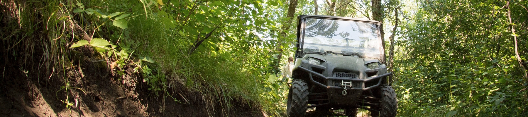 Off-Highway Vehicle driving on a trail