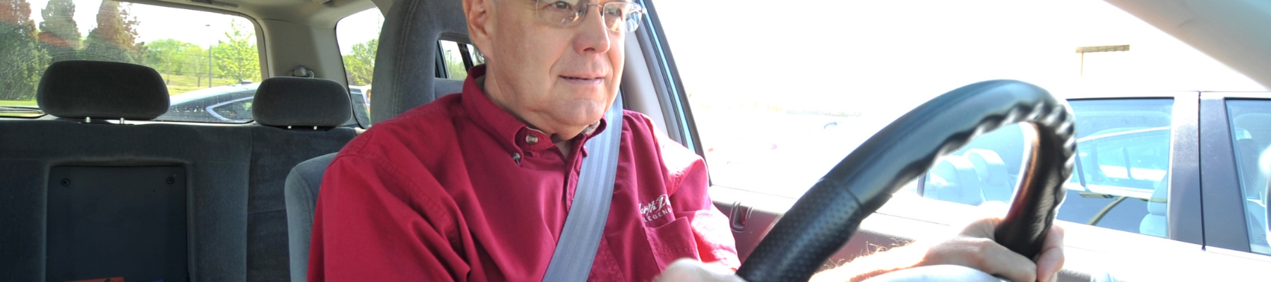 Older driver wearing a seatbelt